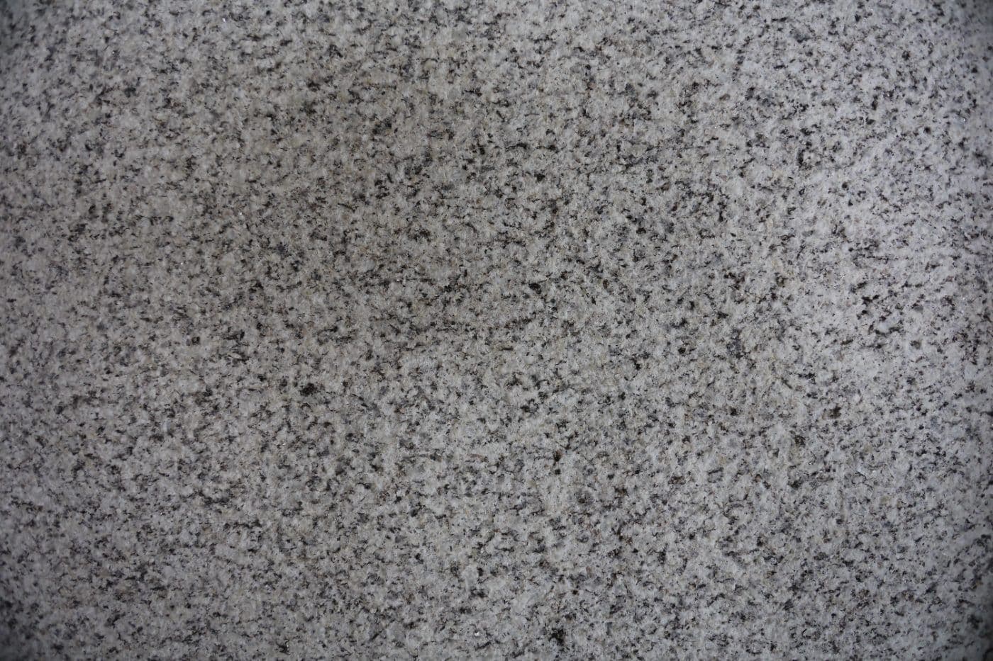 De Lank Cornish granite dolly pointed finish — A traditional masonry finish produced by hand-held punching tools. The most slip